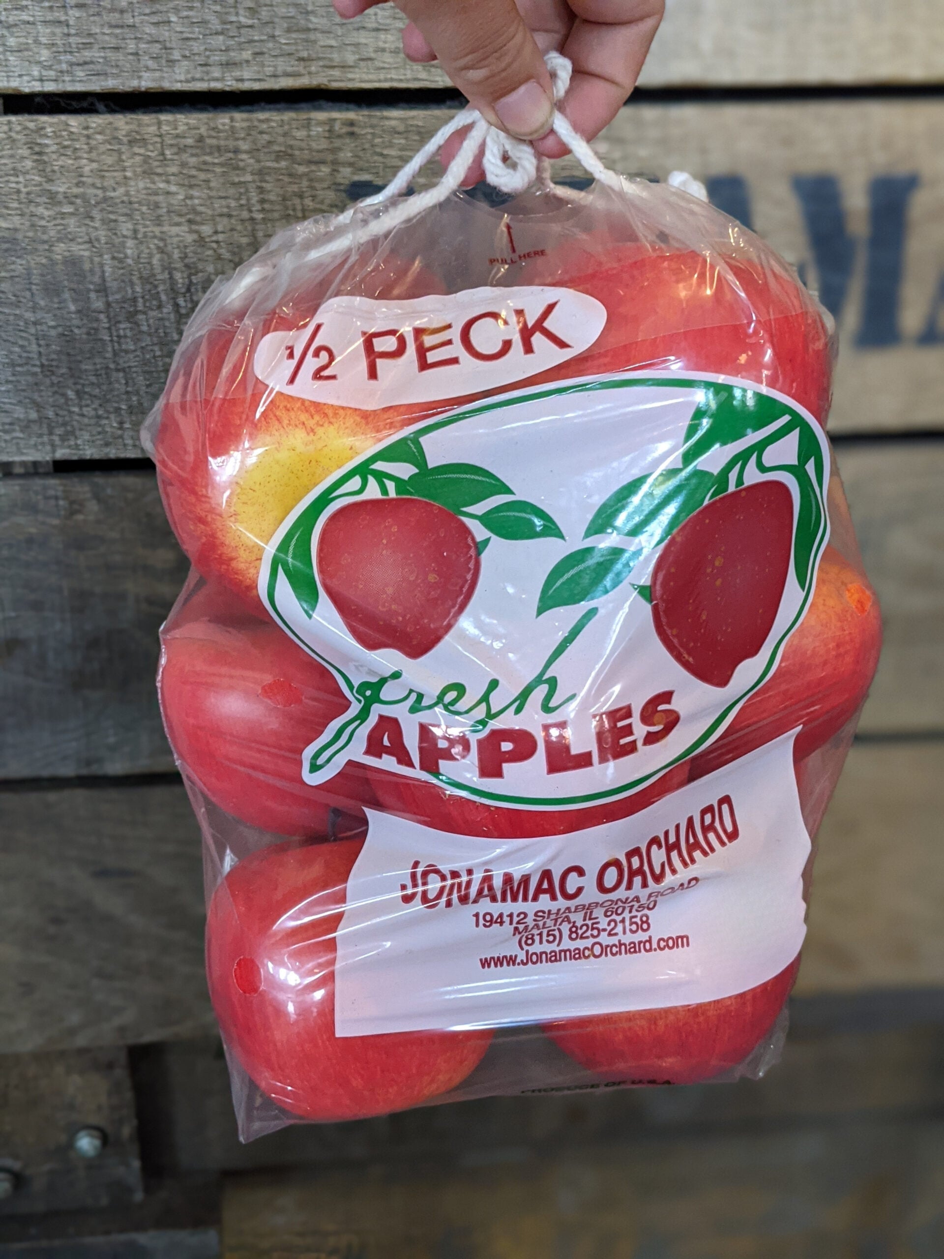 Bag of fresh red apples from Jonamac Orchard.
