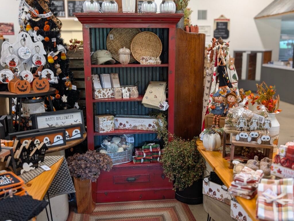 Colorful Halloween decorations in a festive store display.
