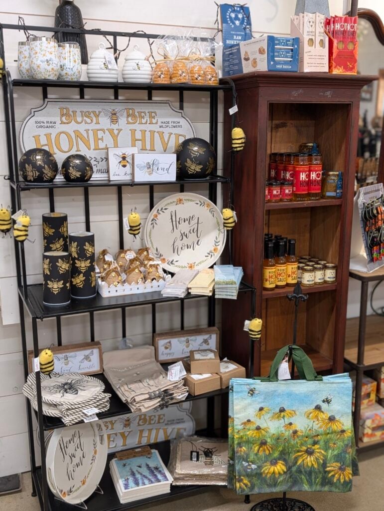 Bee-themed decor and honey products displayed on shelves.