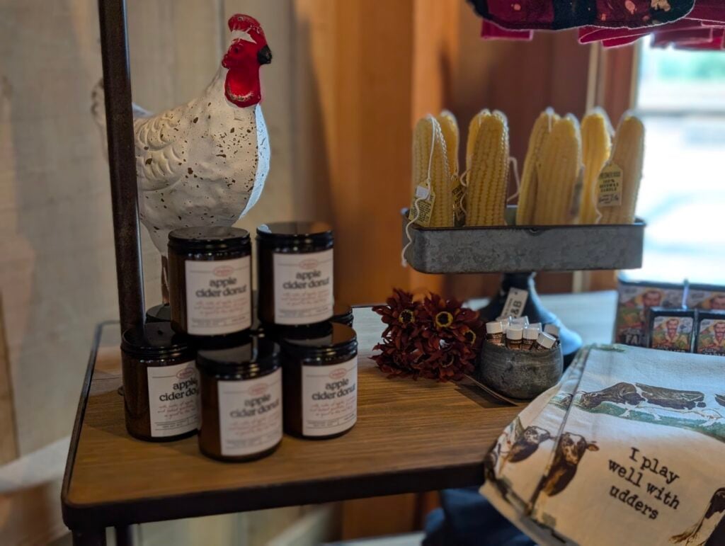 Farm market display with candles and decor items.